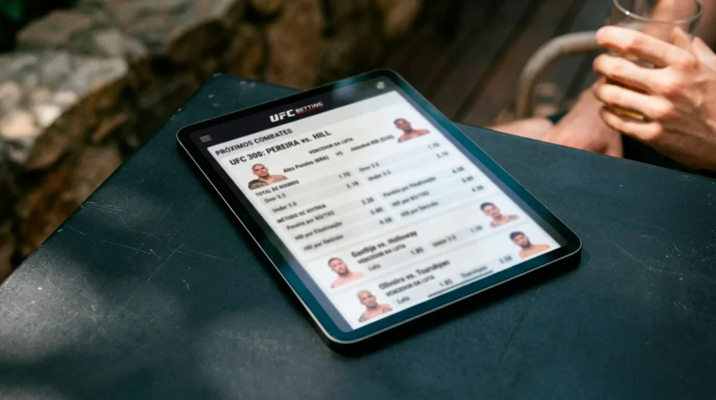 Interface de plataforma de apostas mostrando mercados de UFC com moneyline e rounds